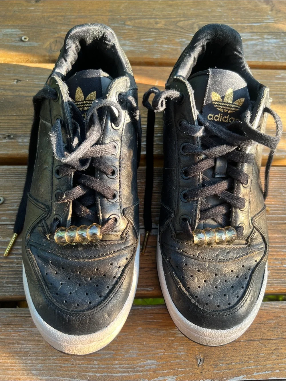 adidas Forum Black Leather Low-Top Sneakers with Gold Accents